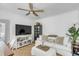 Comfortable living room with a TV, books, and a cozy white couch at 107 Bogard St, Charleston, SC 29403