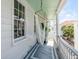 Relaxing porch with white railings, a stylish rug, and a comfortable hammock at 107 Bogard St, Charleston, SC 29403