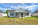 A spacious backyard with a screened in patio and well-maintained lawn perfect for entertaining at 1137 Moss Grove Dr Dr, Moncks Corner, SC 29461