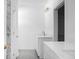 Bathroom with dual sinks, white cabinets, marble wall, and walk-in closet at 1137 Moss Grove Dr Dr, Moncks Corner, SC 29461