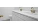 Bathroom features double sink vanity with sleek white countertop and modern gold hardware at 1137 Moss Grove Dr Dr, Moncks Corner, SC 29461