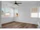 Bright bedroom with wood floors, white walls, and multiple windows for natural light at 1137 Moss Grove Dr Dr, Moncks Corner, SC 29461
