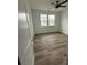 Bedroom with hardwood floors, ceiling fan and windows that let in lots of natural light at 1137 Moss Grove Dr Dr, Moncks Corner, SC 29461