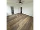 Spacious bedroom with modern lighting, wood-style flooring, and two access doors at 1137 Moss Grove Dr Dr, Moncks Corner, SC 29461