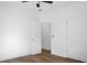 Well-lit bedroom features a ceiling fan, wood-look flooring, and doors to a walk-in closet at 1137 Moss Grove Dr Dr, Moncks Corner, SC 29461