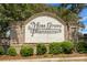 Elegant brick community sign showcasing 'Moss Grove Plantation' amidst lush landscaping at 1137 Moss Grove Dr Dr, Moncks Corner, SC 29461