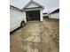 Detached garage with an open door and a dirty driveway at 1137 Moss Grove Dr Dr, Moncks Corner, SC 29461