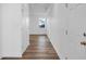 Hallway featuring hardwood floors, white walls and doors at 1137 Moss Grove Dr Dr, Moncks Corner, SC 29461