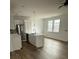 Modern kitchen featuring stainless steel appliances, white cabinetry, and a center island with a sink at 1137 Moss Grove Dr Dr, Moncks Corner, SC 29461