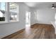 Open living room featuring hardwood floors and access to the porch at 1137 Moss Grove Dr Dr, Moncks Corner, SC 29461
