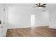 Spacious living room featuring wood floors, white walls, and modern lighting at 1137 Moss Grove Dr Dr, Moncks Corner, SC 29461