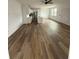 Spacious living room featuring modern lighting, wood-style flooring, and a bright, airy open floor plan at 1137 Moss Grove Dr Dr, Moncks Corner, SC 29461