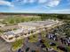 Aerial view of shopping center featuring a variety of stores, ample parking, and green landscaping at 114 Belfort Pl, Summerville, SC 29486