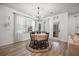 Charming dining area with a round table, stylish chandelier, and views to the outdoor space at 114 Belfort Pl, Summerville, SC 29486