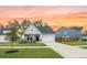 Inviting single-story home with a well-maintained lawn, driveway, and cozy front porch at 114 Belfort Pl, Summerville, SC 29486