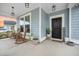 Cozy front porch featuring rocking chairs, plants, and a welcoming entrance at 114 Belfort Pl, Summerville, SC 29486