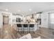 Open kitchen with island seating, stainless steel appliances, and stylish light fixtures; great for entertaining at 114 Belfort Pl, Summerville, SC 29486