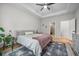 A bright and airy main bedroom featuring a large bed, bedside table, and modern decor at 114 Belfort Pl, Summerville, SC 29486
