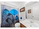 Bright bathroom featuring a white door, blue accents, and sleek fixtures at 1227 Cosmos Rd, Summerville, SC 29483