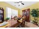 Charming dining room with wood table set, display cabinet, and decoratively tiled floor at 1227 Cosmos Rd, Summerville, SC 29483