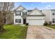 Well-maintained two-story home with a two-car garage and manicured lawn at 1227 Cosmos Rd, Summerville, SC 29483