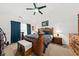 The luxurious main bedroom features a king bed, matching furniture, and a large window with ample lighting at 1227 Cosmos Rd, Summerville, SC 29483