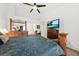 The bright main bedroom includes a king bed, dresser, a large window with ample lighting, and private ensuite access at 1227 Cosmos Rd, Summerville, SC 29483