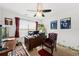 Comfortable office with a ceiling fan, a leather chair, and a patterned rug at 1227 Cosmos Rd, Summerville, SC 29483