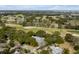 Aerial view of a house near a golf course, surrounded by lush trees and beautiful scenery at 1429 Burningtree Rd, Charleston, SC 29412