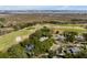 An aerial view highlighting a residence near a golf course with expansive green fairways and nearby marshland at 1429 Burningtree Rd, Charleston, SC 29412
