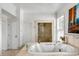 Bathroom with tile floors, standalone jetted tub, and glass enclosed shower at 1429 Burningtree Rd, Charleston, SC 29412