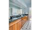 Bathroom featuring a long vanity with double sinks and decorative mirror at 1429 Burningtree Rd, Charleston, SC 29412