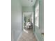 Hallway view of bathroom with a soaking tub and vanity with decorative mirrors at 1429 Burningtree Rd, Charleston, SC 29412