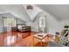 This bedroom features a unique ceiling, gleaming hardwood floors, and abundant natural light at 1429 Burningtree Rd, Charleston, SC 29412