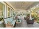 This covered patio has comfortable outdoor seating and offers a relaxing atmosphere at 1429 Burningtree Rd, Charleston, SC 29412