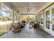 This covered patio features ample seating and views of the backyard at 1429 Burningtree Rd, Charleston, SC 29412