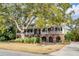 Beautiful two-story home featuring a covered porch, well-maintained landscaping, and a welcoming entrance at 1429 Burningtree Rd, Charleston, SC 29412