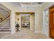 Elegant foyer with tile floors, chandelier, and view to dining room at 1429 Burningtree Rd, Charleston, SC 29412