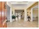 Grand foyer with tile floors, chandelier, and view to living area and natural light at 1429 Burningtree Rd, Charleston, SC 29412