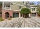 The exterior showcasing an attached brick facade garage that has gray siding to match the two-story home at 1429 Burningtree Rd, Charleston, SC 29412