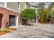 Exterior view of attached garages on a two-story home with brick and gray siding at 1429 Burningtree Rd, Charleston, SC 29412