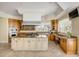 Bright kitchen with custom cabinets, granite counters, stainless appliances, and island cooktop at 1429 Burningtree Rd, Charleston, SC 29412