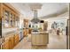 Spacious kitchen with stainless steel appliances, a central island, granite countertops, and travertine floors at 1429 Burningtree Rd, Charleston, SC 29412