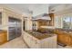 Well-equipped kitchen featuring stainless steel appliances, granite countertops, and an island cooktop at 1429 Burningtree Rd, Charleston, SC 29412