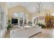 Bright living room features tall ceilings, many windows, neutral paint, and tile floors at 1429 Burningtree Rd, Charleston, SC 29412