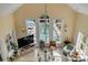 Bright living room with large windows offering a view of the outdoor pool at 1429 Burningtree Rd, Charleston, SC 29412