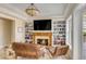 Comfortable living room with fireplace, built-in shelves, and natural light at 1429 Burningtree Rd, Charleston, SC 29412