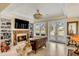 Cozy living room featuring built-in bookshelves, fireplace, and access to the backyard at 1429 Burningtree Rd, Charleston, SC 29412