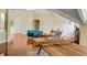 Large living space with hardwood floors, games, and stylish furniture at 1429 Burningtree Rd, Charleston, SC 29412