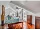 Bright main bedroom featuring a four poster bed, high ceilings and gleaming hardwood floors at 1429 Burningtree Rd, Charleston, SC 29412